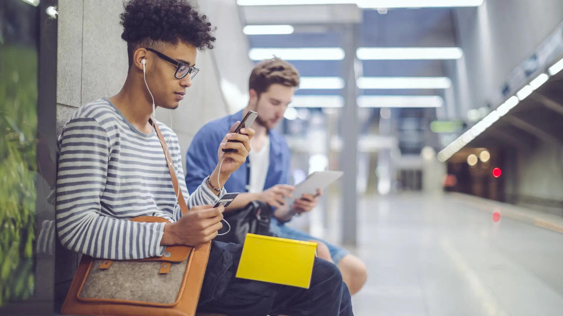 Students sitting in a corridor