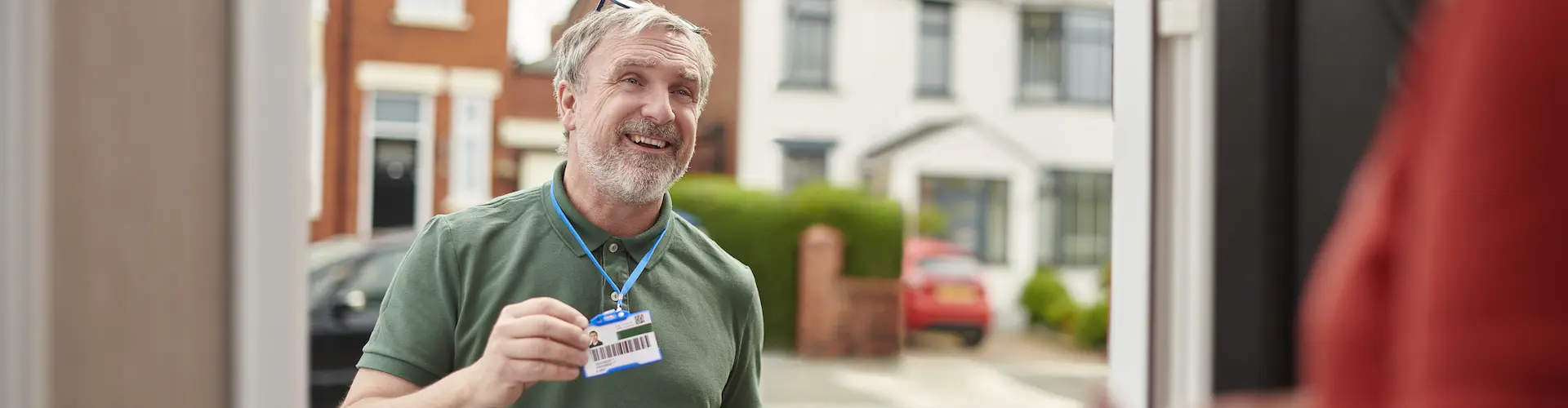Social Worker showing his identity at a front door