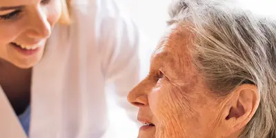 Home manager talking to resident