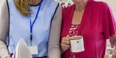 Carer helping her client