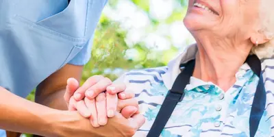 Carer helping her client